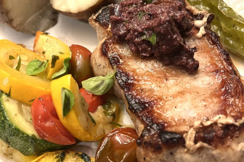 Grilled Pork Chops with Black Olive Tapenade and Roasted Summer Vegetables